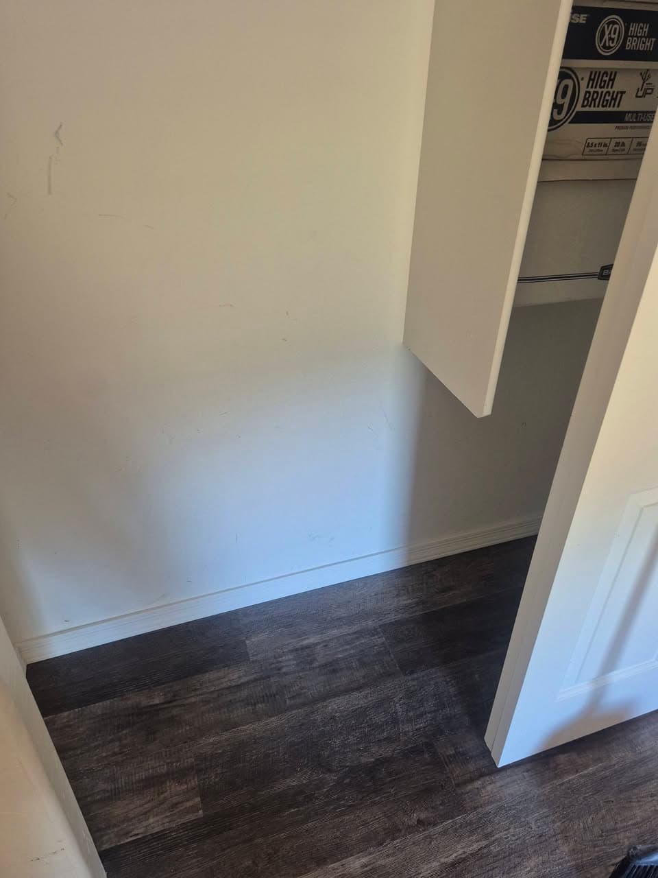After: small room with finished wood-look plank flooring